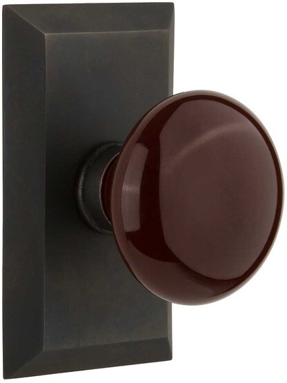 New York Rosette Door Set with Brown Porcelain Knobs in Oil-Rubbed Bronze.